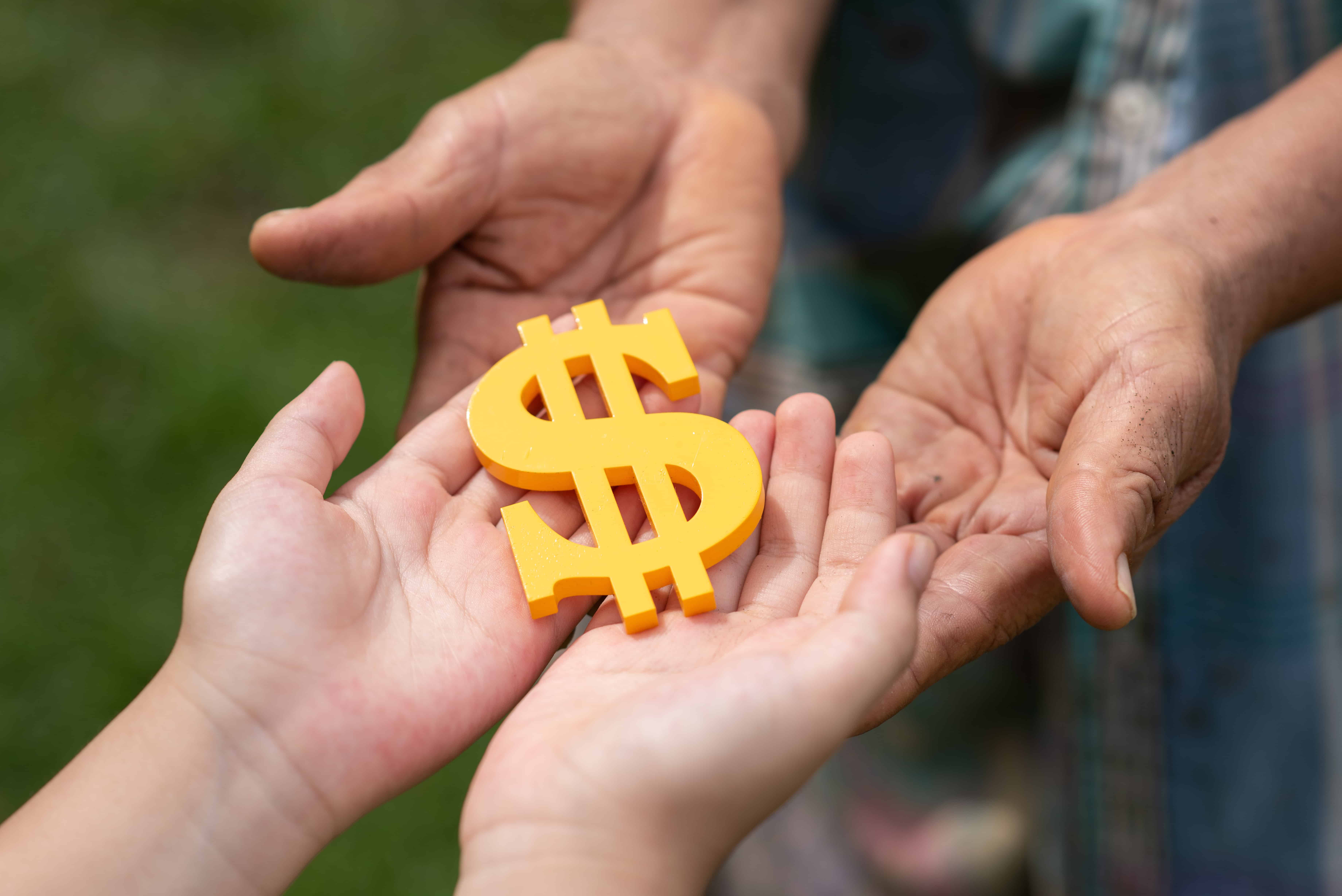 People holding a dollar sign.